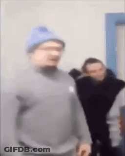 Man In Blue Hat And Gray Sweatshirt GIF