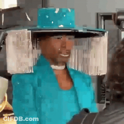 Man In Blue Hat And Jacket Smiling GIF