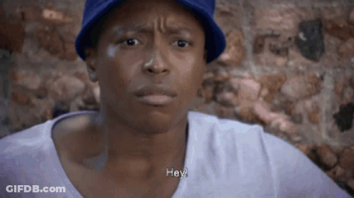 Man In Blue Hat And Purple Shirt Saying Hey GIF