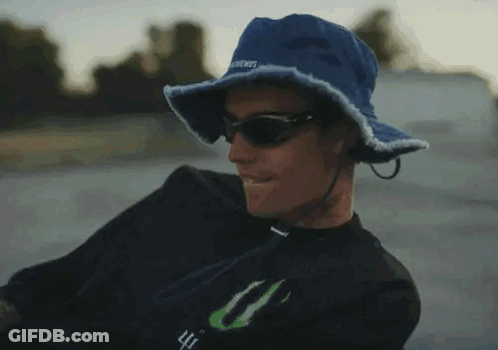 Man In Blue Hat And Sunglasses With Monster Logo GIF
