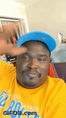 Man In Blue Hat And Yellow Denver Broncos Shirt GIF