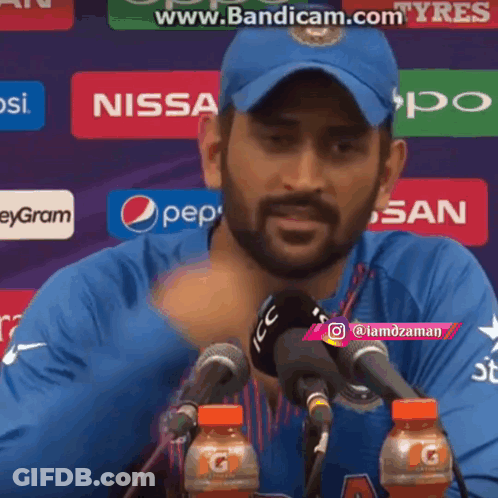 Man In Blue Hat At Microphone With Pepsi And Gatorade GIF