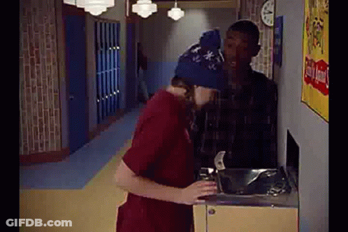Man In Blue Hat Drinking From Water Fountain GIF