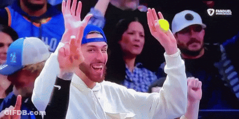 Man In Blue Hat Holding Yellow Ball GIF