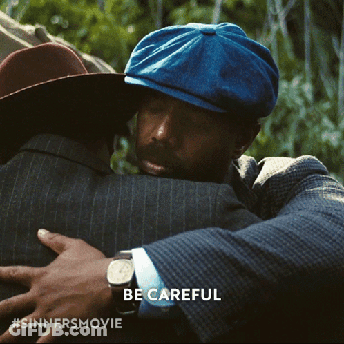 Man In Blue Hat Hugging GIF