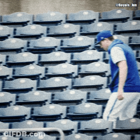 Man In Blue Hat In Front Of Blue Seats GIF