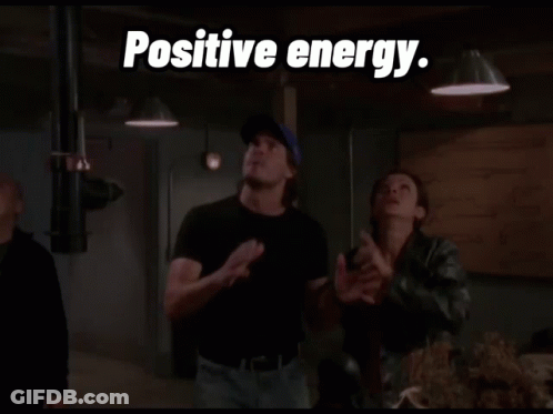 Man In Blue Hat In Front Of Weaponless Sign GIF