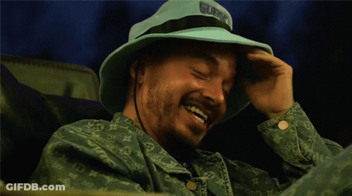 Man In Blue Hat Saying Guns GIF