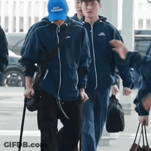 Man In Blue Hat Saying Keep Moving GIF