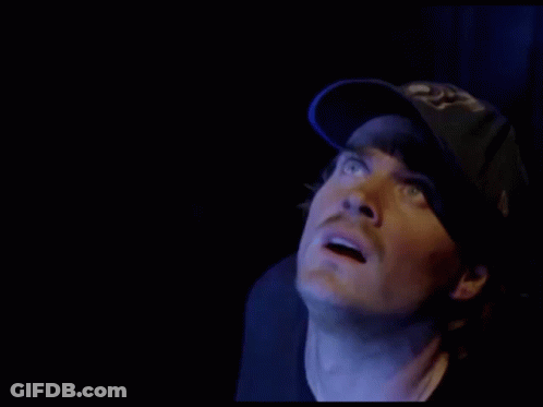Man In Blue Hat Saying LA Looking At Something GIF