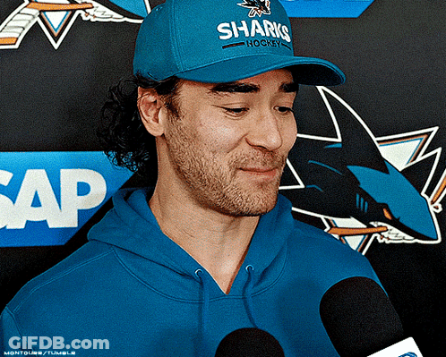 Man In Blue Hat Saying Sharks Hockey GIF