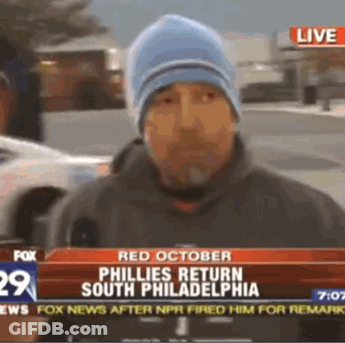 Man In Blue Hat Talking Into Microphone On Fox News GIF