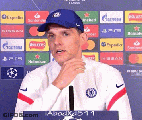 Man In Blue Hat With Heineken Nissan Expedia Logos GIF