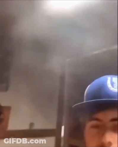 Man In Blue Hat With Horseshoe GIF