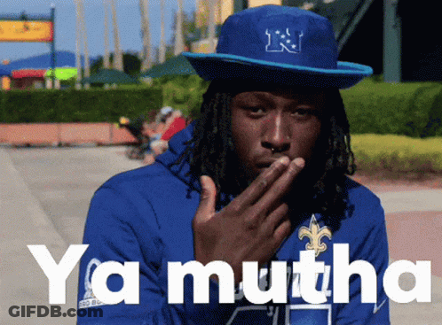 Man In Blue Hat With Letter N Covering Mouth GIF