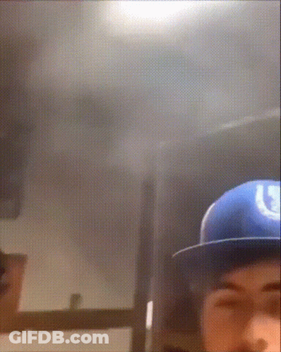 Man In Blue Hat With Letter U GIF