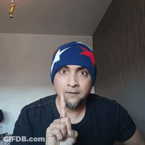Man In Blue Hat With Red White Blue Star GIF
