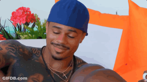 Man In Blue Hat With Tattoo Saying 09 GIF