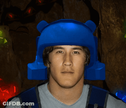 Man In Blue Helmet In Front Of Glowing Gems GIF