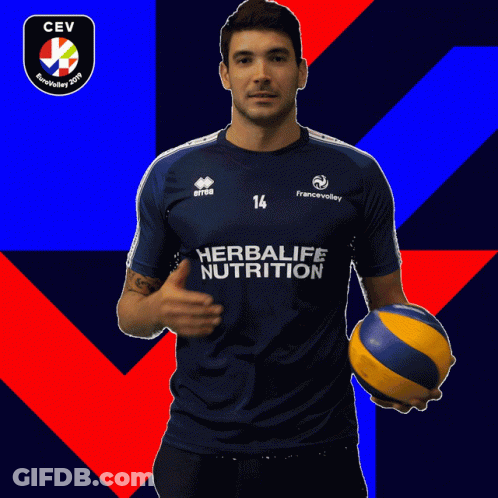 Man In Blue Herbalife Nutrition Shirt Holding Volleyball GIF