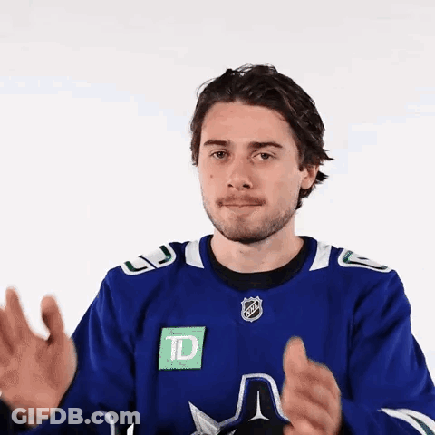 Man In Blue Hockey Jersey Clapping GIF
