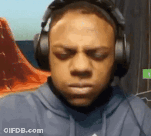 Man In Blue Hoodie And Headphones Looking At Camera GIF