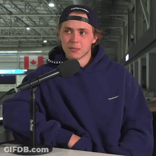 Man In Blue Hoodie At Dr. Singer Microphone GIF