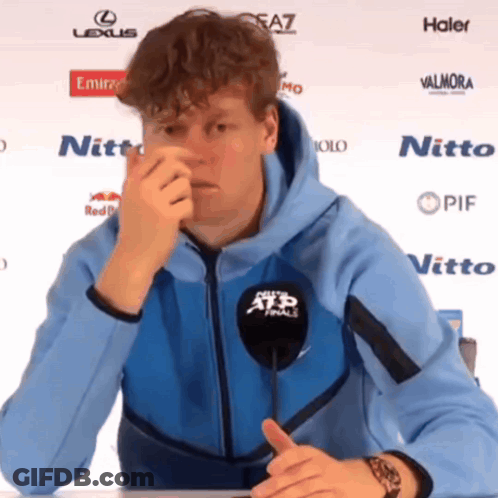 Man In Blue Hoodie At Microphone Saying ATP Finals GIF