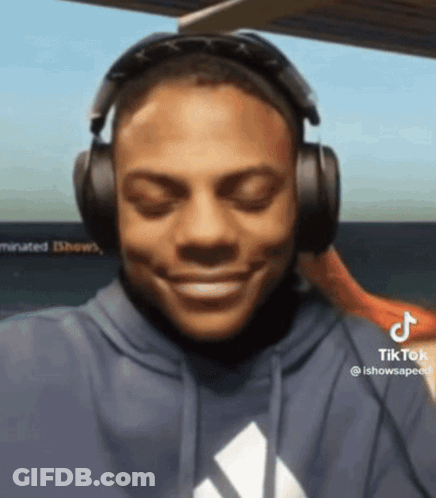 Man In Blue Hoodie Listening To TikTok GIF