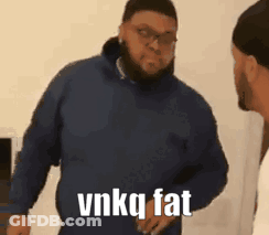 Man In Blue Hoodie Next To Man In Black Hat GIF