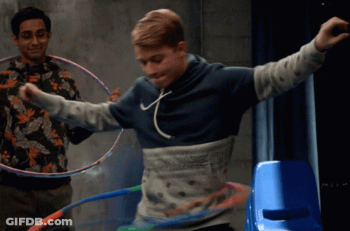 Man In Blue Hoodie Playing Hula Hoop GIF