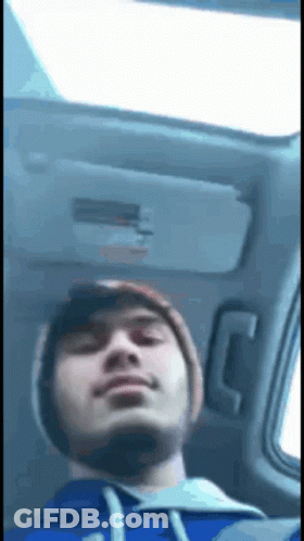 Man In Blue Hoodie Sitting In Back Seat GIF