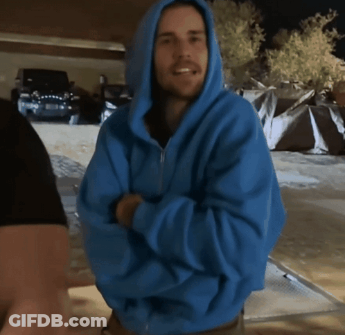 Man In Blue Hoodie Smiling With Arms Crossed GIF