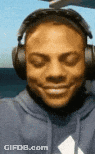 Man In Blue Hoodie Smiling With Headphones GIF