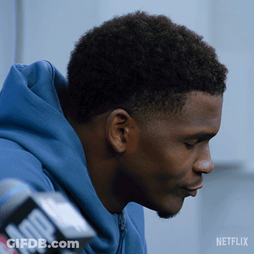 Man In Blue Hoodie Talking Into Microphone GIF