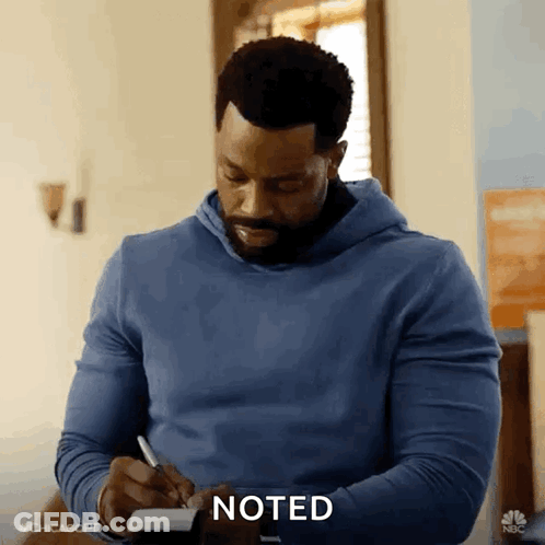 Man In Blue Hoodie Writing GIF