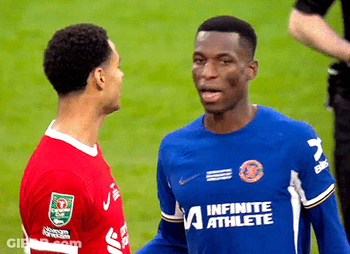 Man In Blue Infinite Athlete Jersey Talking To Another Man GIF