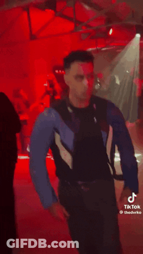 Man In Blue Jacket And Black Shirt GIF