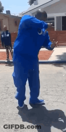 Man In Blue Jacket And Pants GIF