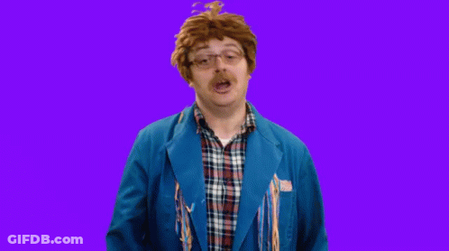 Man In Blue Jacket And Plaid Making Face GIF
