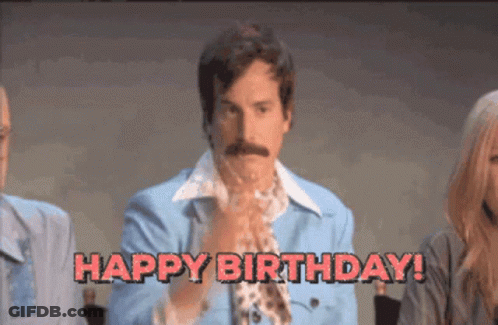 Man In Blue Jacket And Tie Saying Happy Birthday GIF