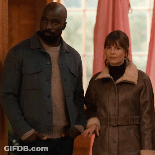Man In Blue Jacket And Woman In Brown Coat GIF