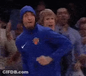 Man In Blue Jacket Dancing In Crowd GIF