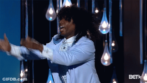Man In Blue Jacket Dancing In Front Of BET Logo GIF
