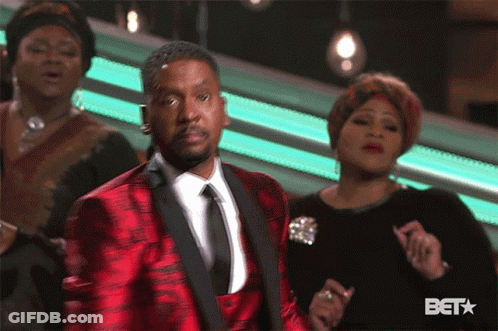 Man In Blue Jacket Dancing In Front Of BET Logo GIF