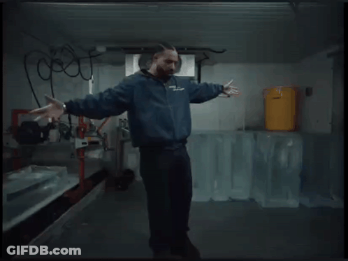Man In Blue Jacket Dancing In Ice Room GIF
