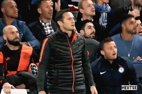 Man In Blue Jacket Dancing In Yellow Vest Saying Heitse GIF