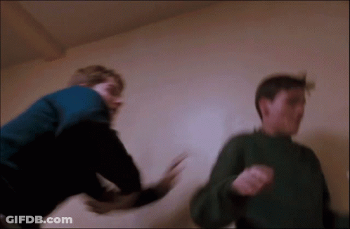 Man In Blue Jacket Fighting Another GIF