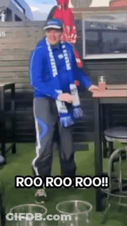 Man In Blue Jacket Holding Bottle Saying Roo Roo Roo GIF