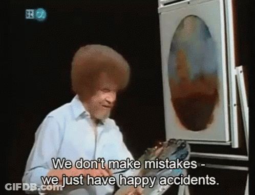 Man In Blue Jacket Holding Box And Magnifying Glass GIF